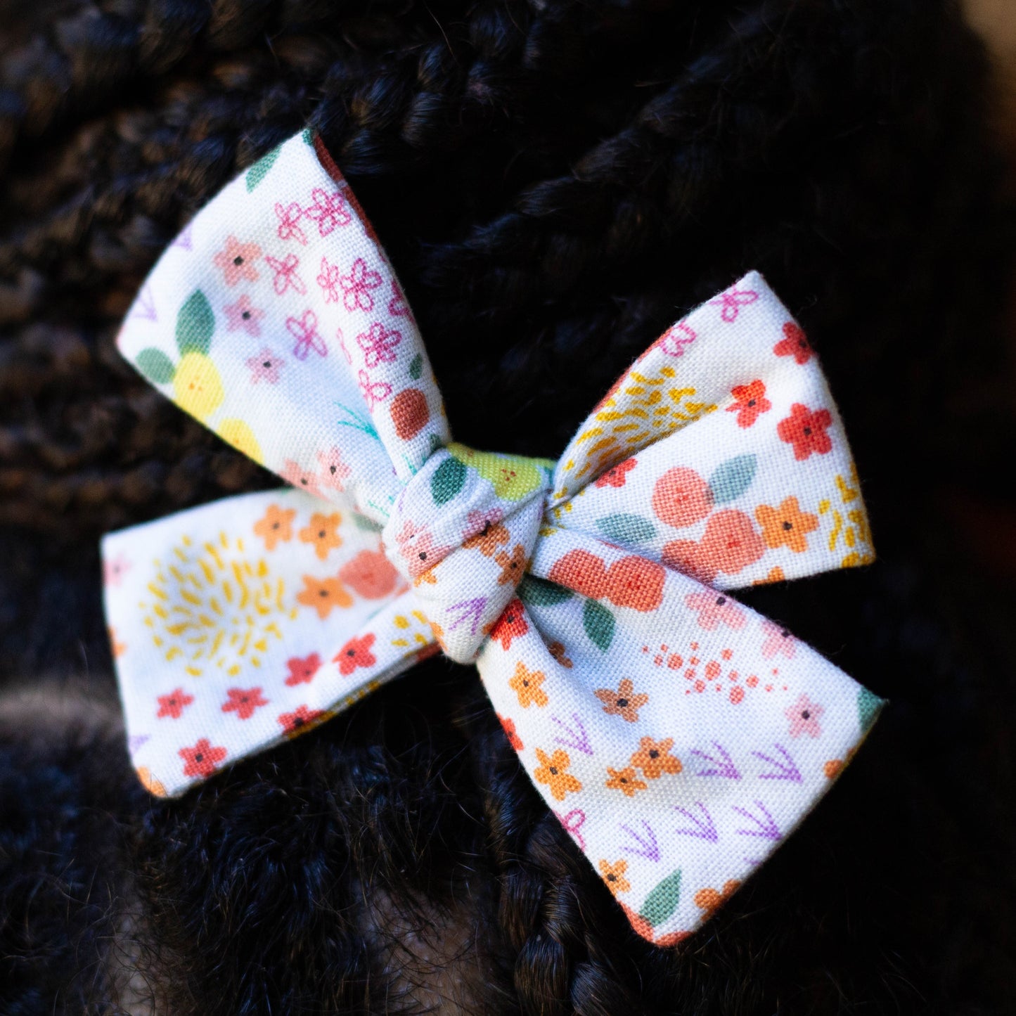 March Blooms florals hair bow in braided hair