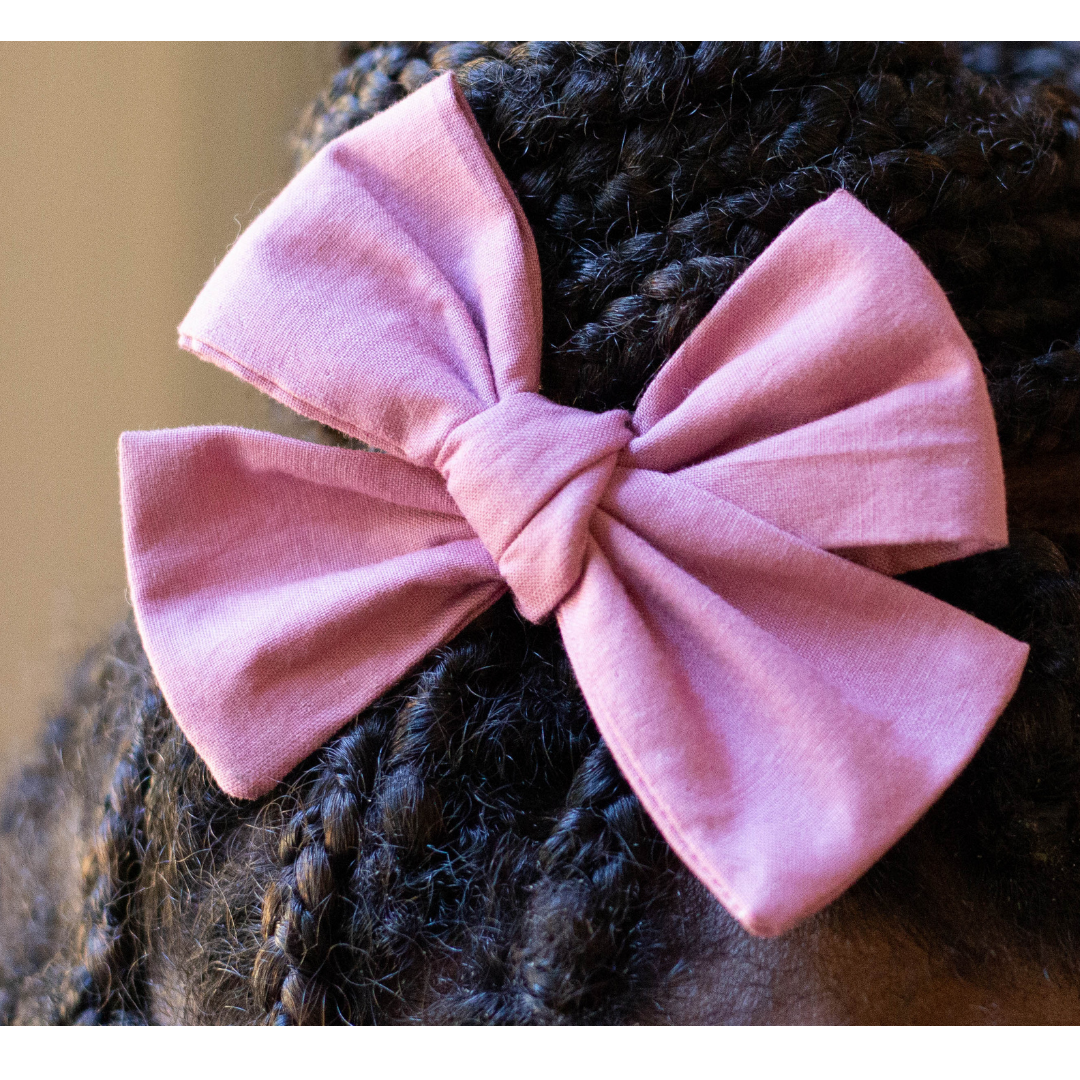 perfect pink pinwheel hair bow in braided hair