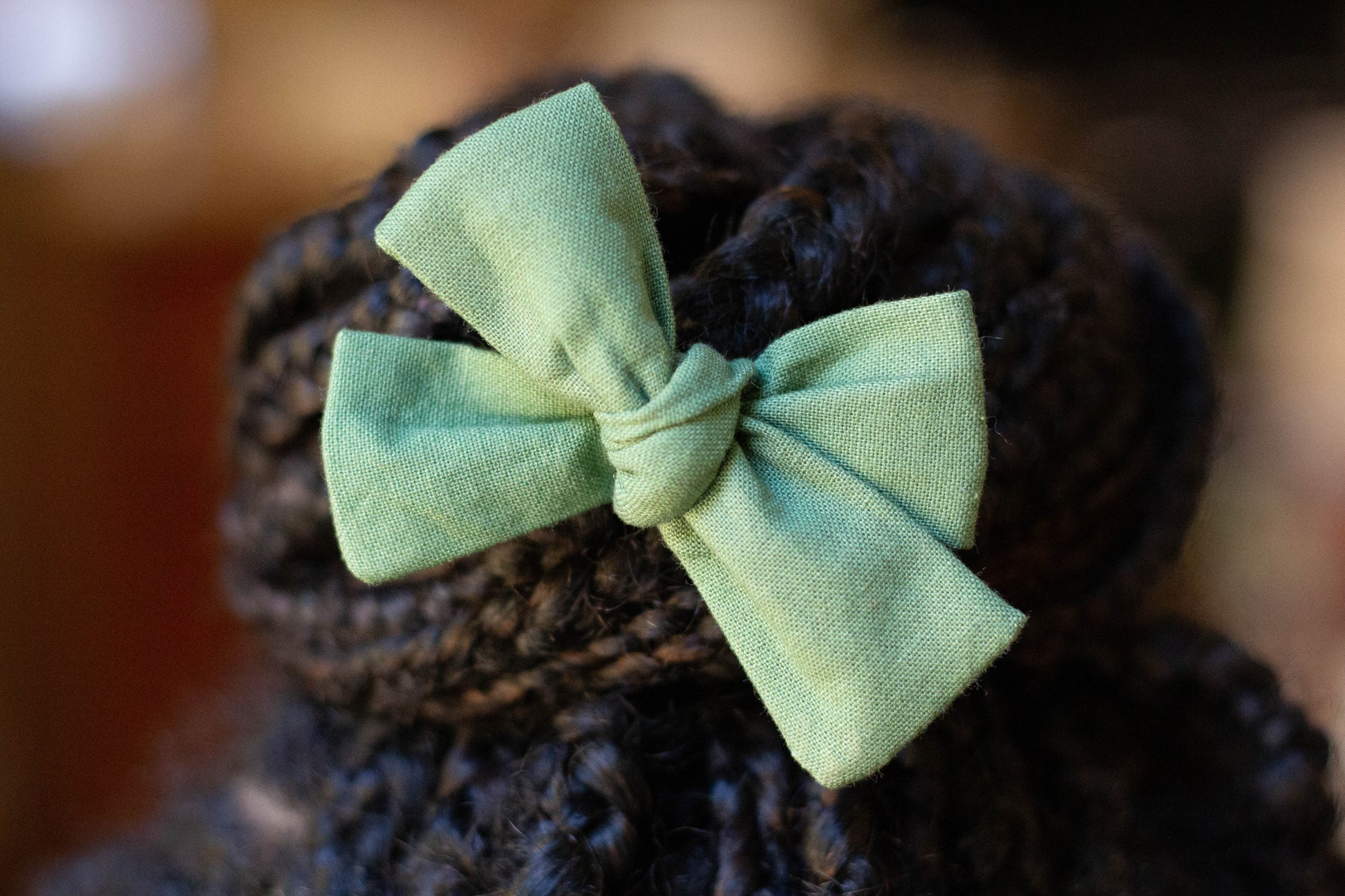 green moss pigtail in braided hair