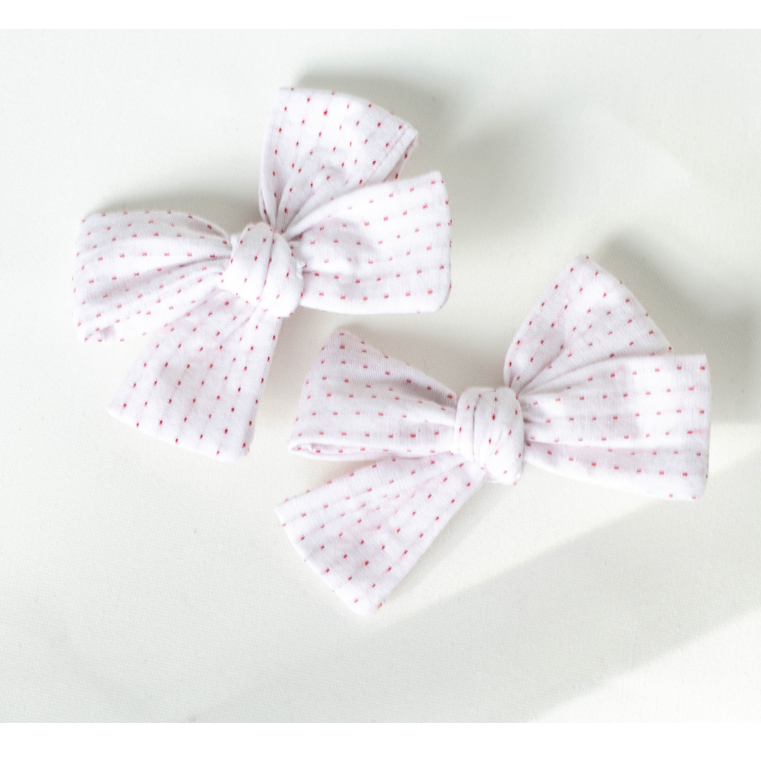 red stitch pigtail bows